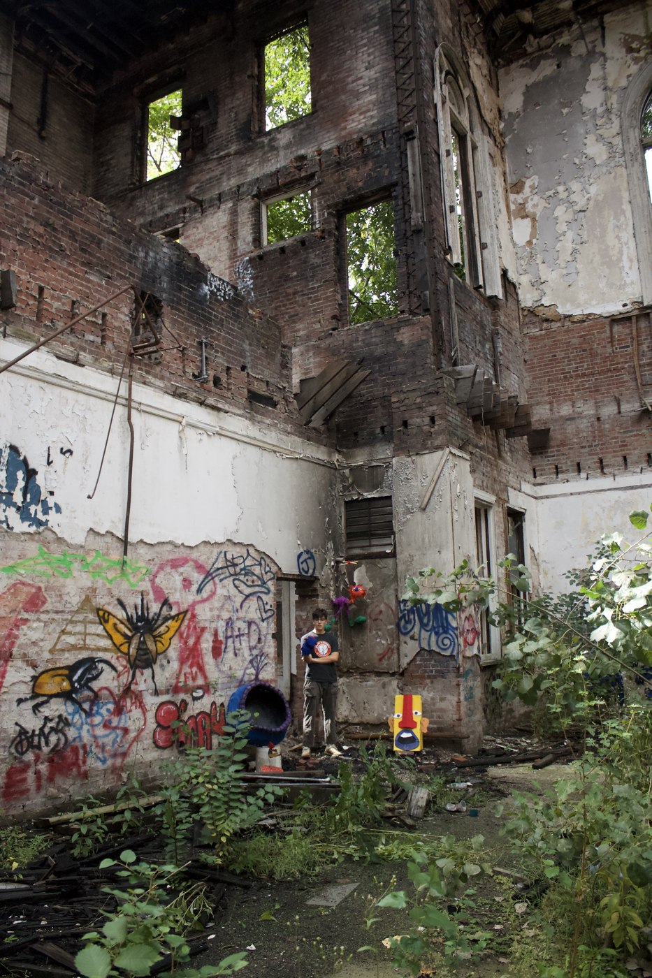In the Midst of the Broken — figure inside the building